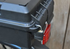 Luggage style padlock in place
